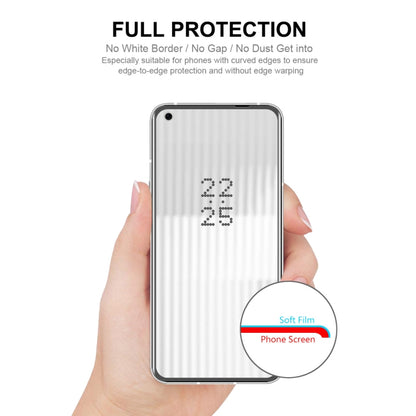 Screen protector film being aligned on a phone screen by hand for full protection