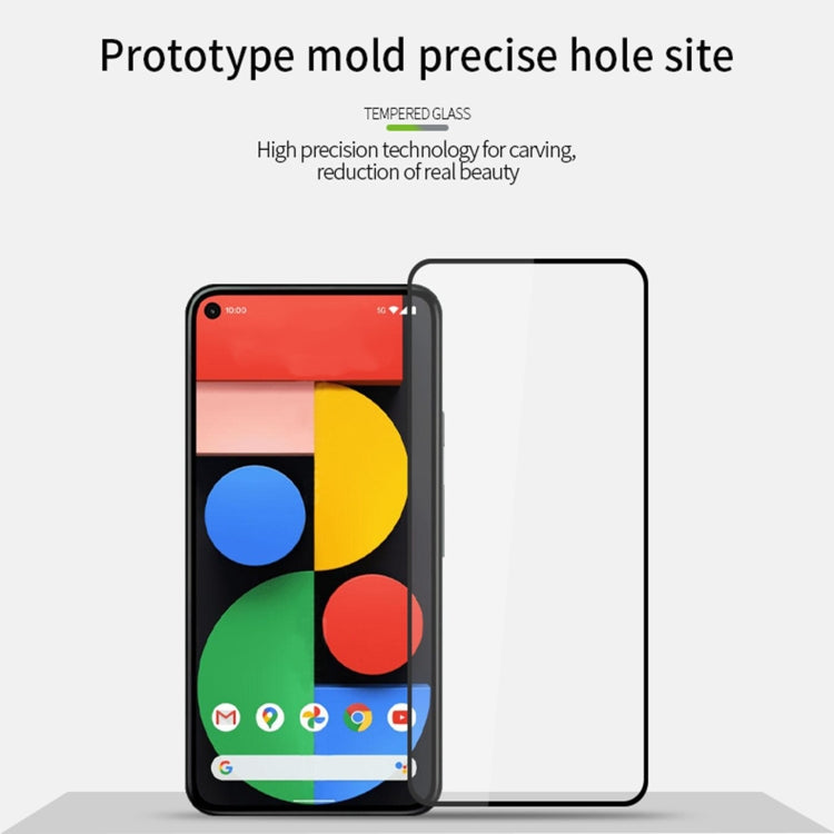 Full-screen tempered glass screen protector film with cutout edges beside smartphone