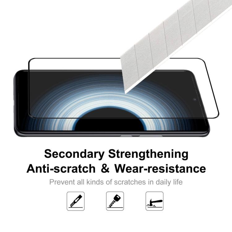 Tempered glass screen protector applied to phone screen for scratch resistance