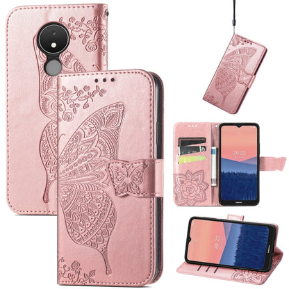 Rose pink flip phone case with embossed butterfly and flower motifs, leather wallet style