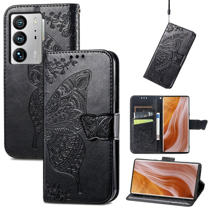 Black embossed flip leather-style phone case with butterfly and flower details, wallet flap