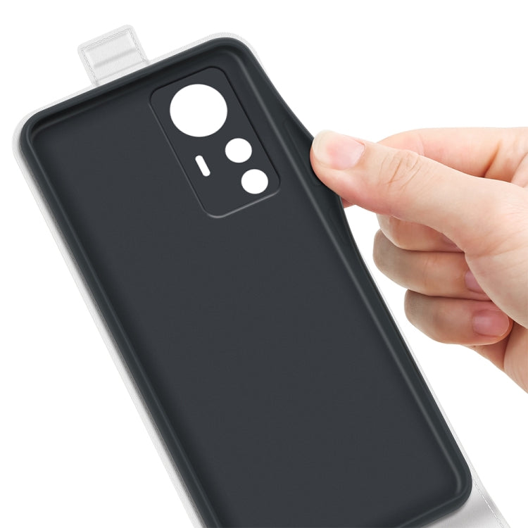 Black leather phone case with camera cutout, held by a hand