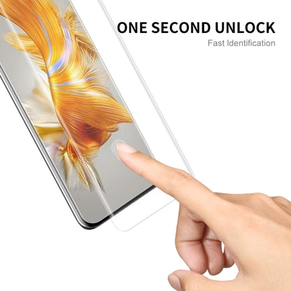 Curved PET screen protector film being applied to Huawei Mate 50 Pro screen