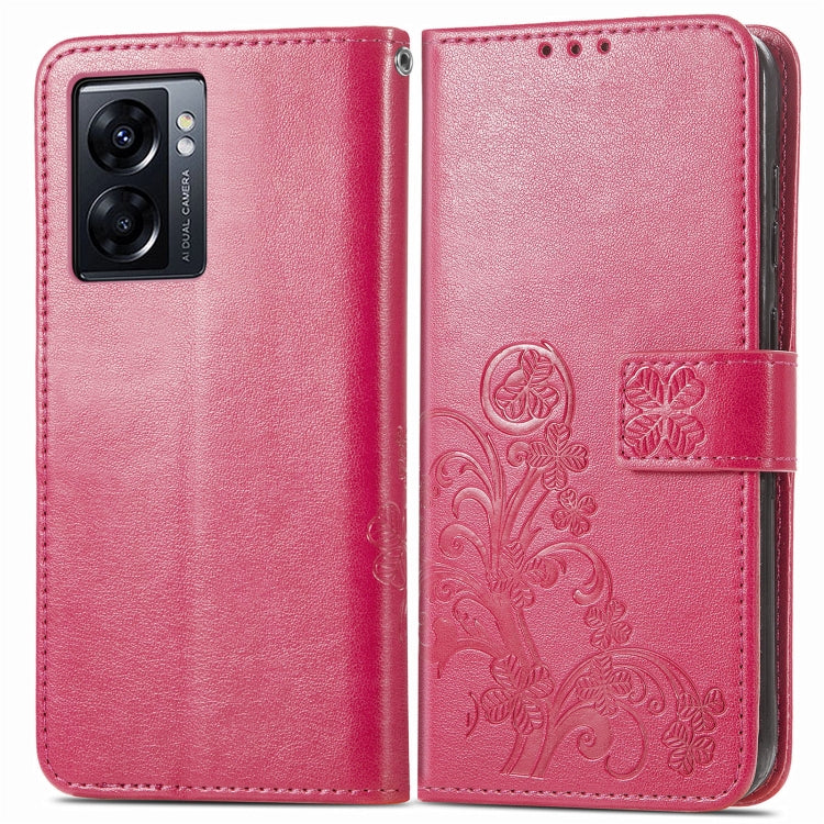 Magenta folio phone case with embossed floral pattern and four-leaf clasp strap