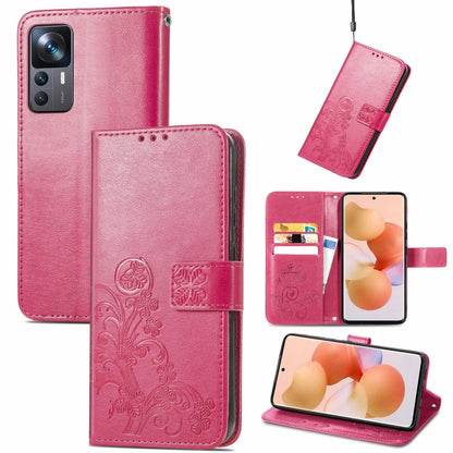 Rose red leather phone case with four-leaf clasp embossed design and flip cover