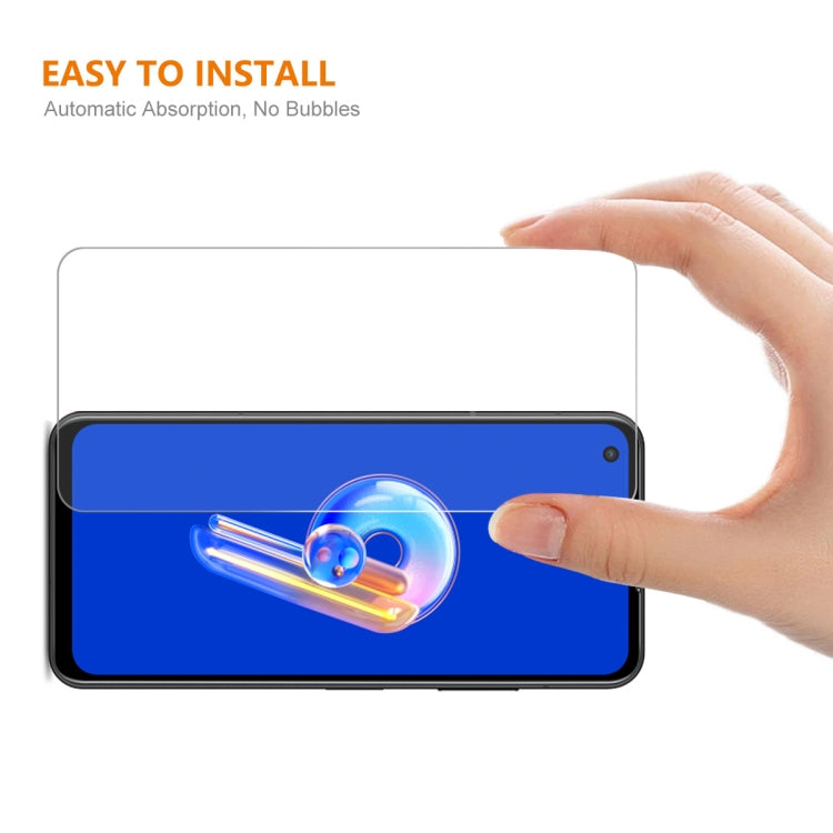 Tempered glass screen protector being applied to Asus Zenfone 9 front