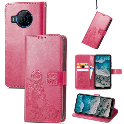 Raspberry pink leather phone case with embossed four-leaf clasp and card holder slots