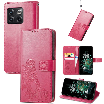 Pink/red leather flip phone case with embossed floral four-leaf clasp and buckle closure