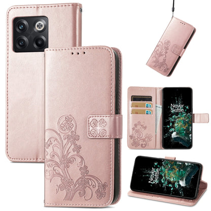 Light pink leather flip phone case with embossed floral four-leaf clasp and buckle closure