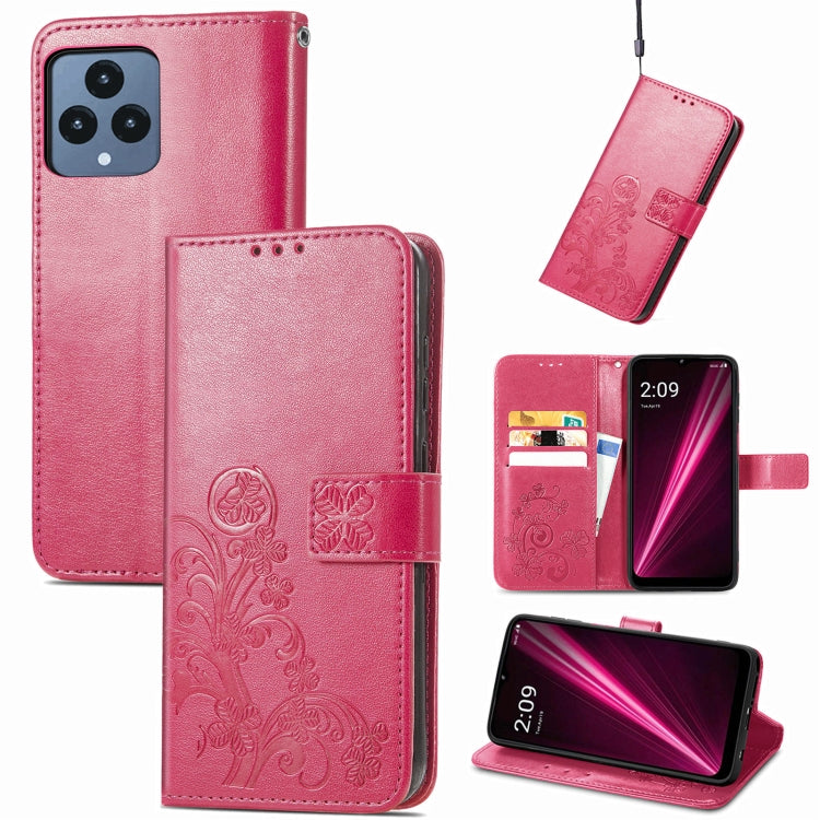 Magenta pink leather flip phone case with embossed floral four-leaf clasp and buckle closure