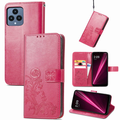 Magenta pink leather flip phone case with embossed floral four-leaf clasp and buckle closure