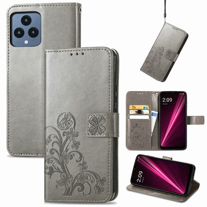 Gray leather phone case with embossed floral clover, clasp buckle, and card slots