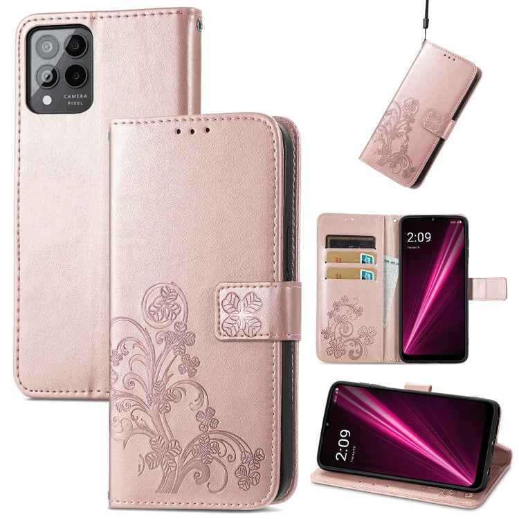 Rose-tone leather phone case with embossed floral clover, clasp buckle, and card slots