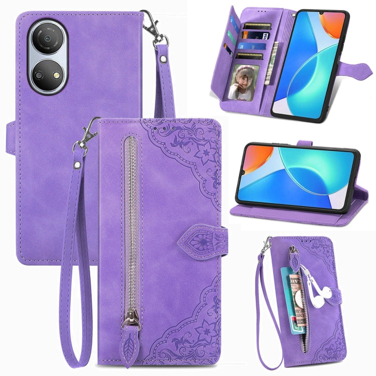 Purple leather phone wallet case with embossed floral pattern, zipper, and wrist strap