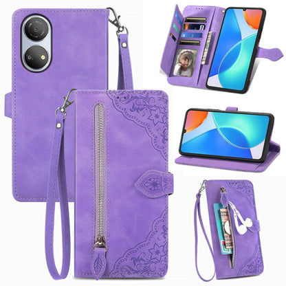 Purple leather phone wallet case with embossed floral pattern, zipper, and wrist strap