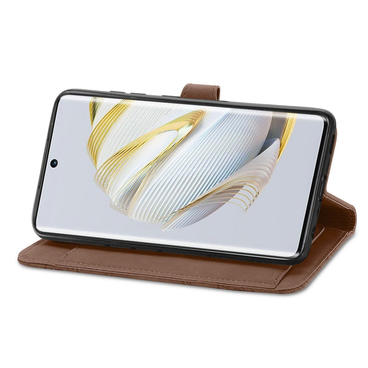Brown embossed zipper wallet phone case in stand mode for a phone screen