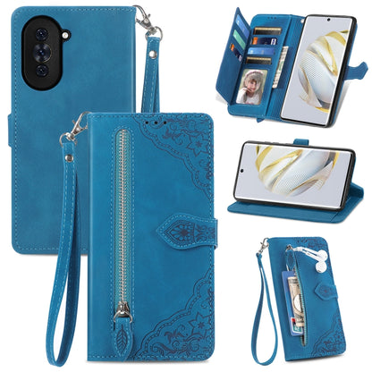 Blue embossed floral zipper wallet phone case with wrist strap and card slots