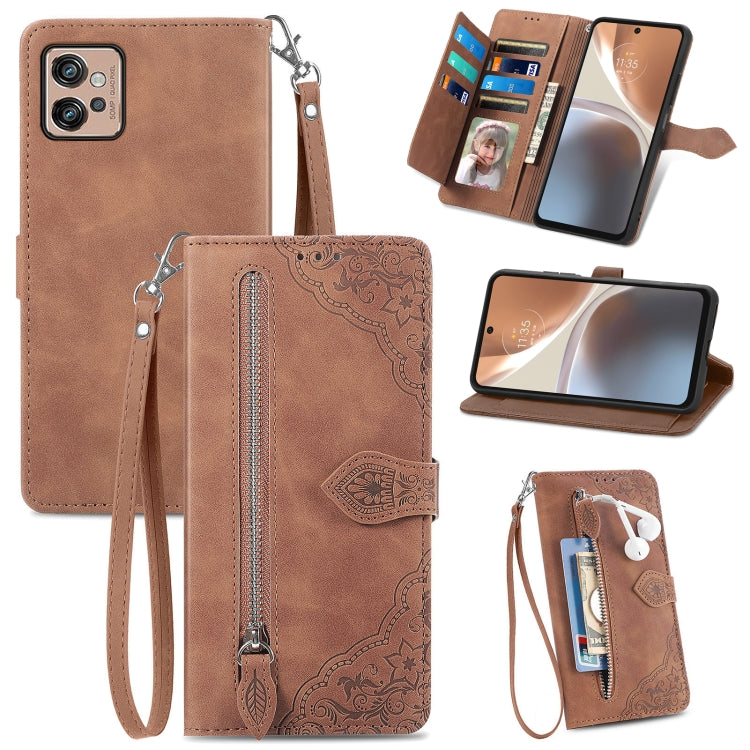 Brown embossed flower leather phone wallet case with zipper, card slots, and wrist strap