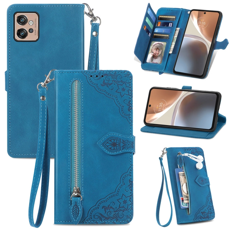 Blue embossed flower leather phone wallet case with zipper, card slots, and wrist strap