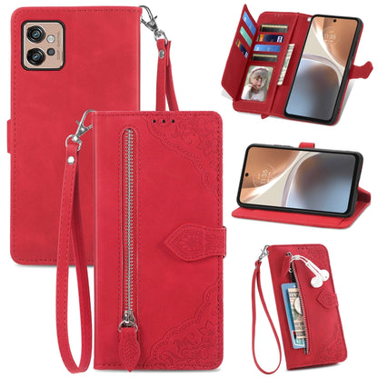Red embossed flower leather phone wallet case with zipper, card slots, and wrist strap
