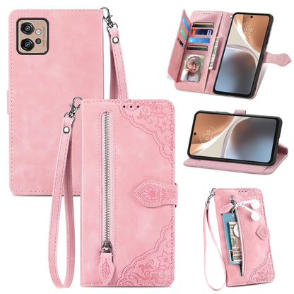 Rose pink embossed flower leather phone wallet case with zipper, card slots, and wrist strap