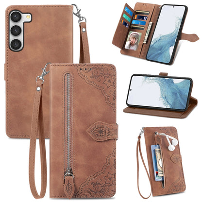Brown embossed leather phone case with zipper, wrist strap, and card slots