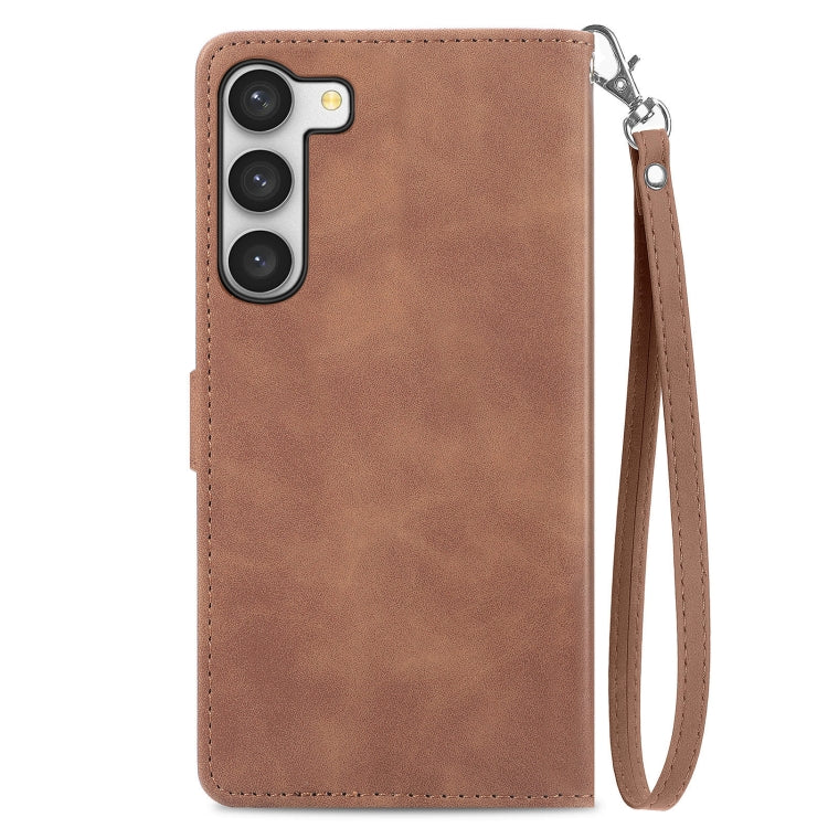 Brown leather phone case with wrist strap and camera cutouts