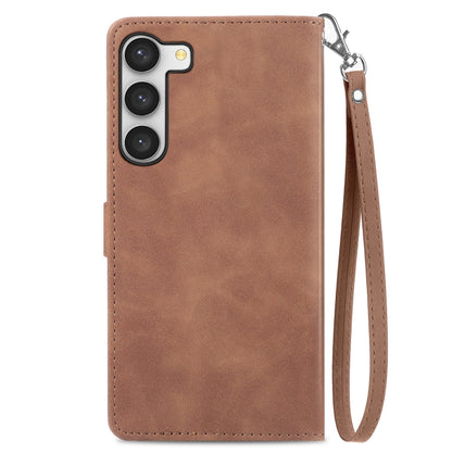 Brown leather phone case with wrist strap and camera cutouts