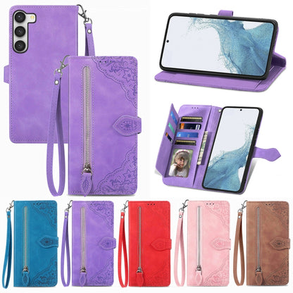 Embossed flower leather phone case with front zipper pocket and wrist strap