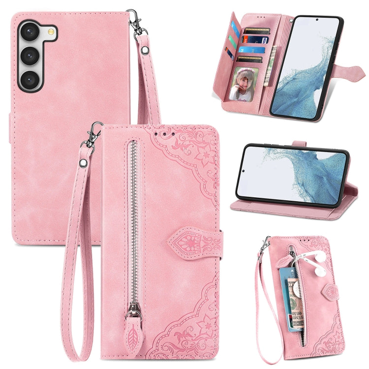 Pink embossed flower zipper leather phone case with wrist strap and card slots