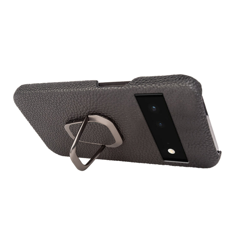 Dark gray leather phone case with metal ring holder, angled back view