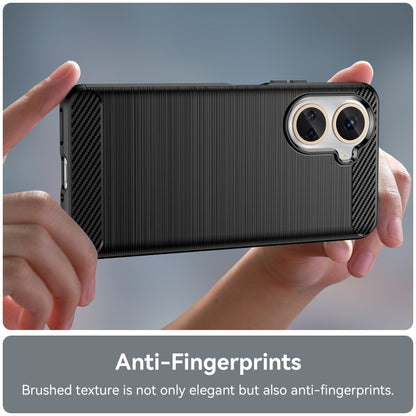 Black brushed carbon fiber TPU phone case held in hands; dual camera cutouts
