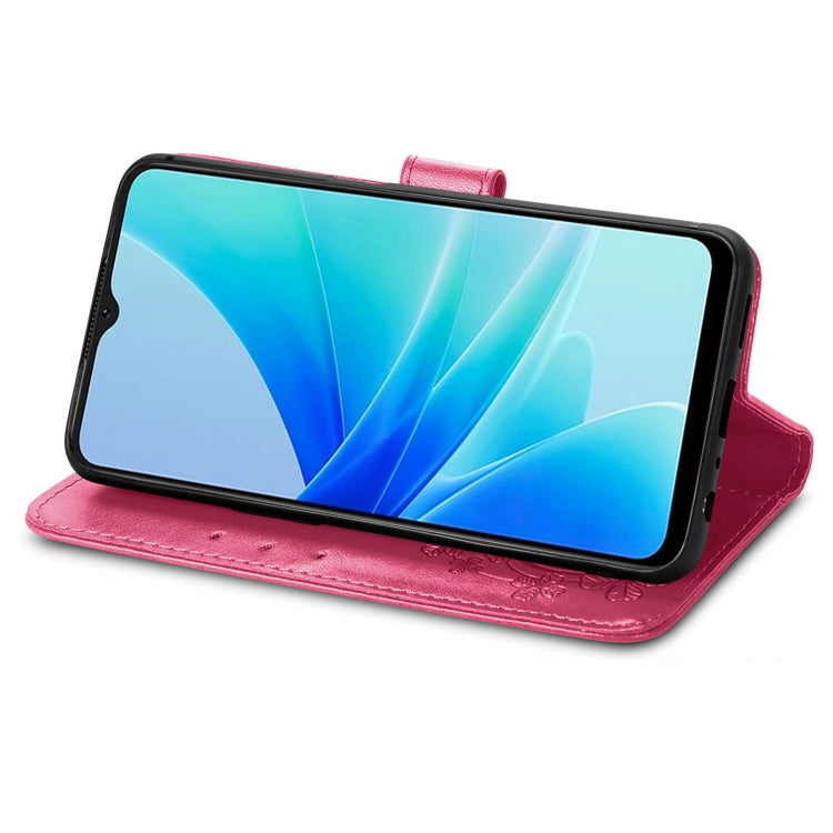 Pink folio leather phone case with embossed details and side buckle strap for stand view.