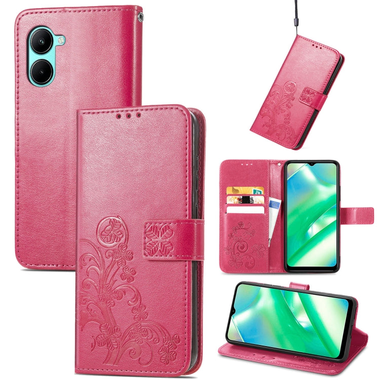 Pink embossed leather phone case with four-leaf clasp, card slots, and kickstand.