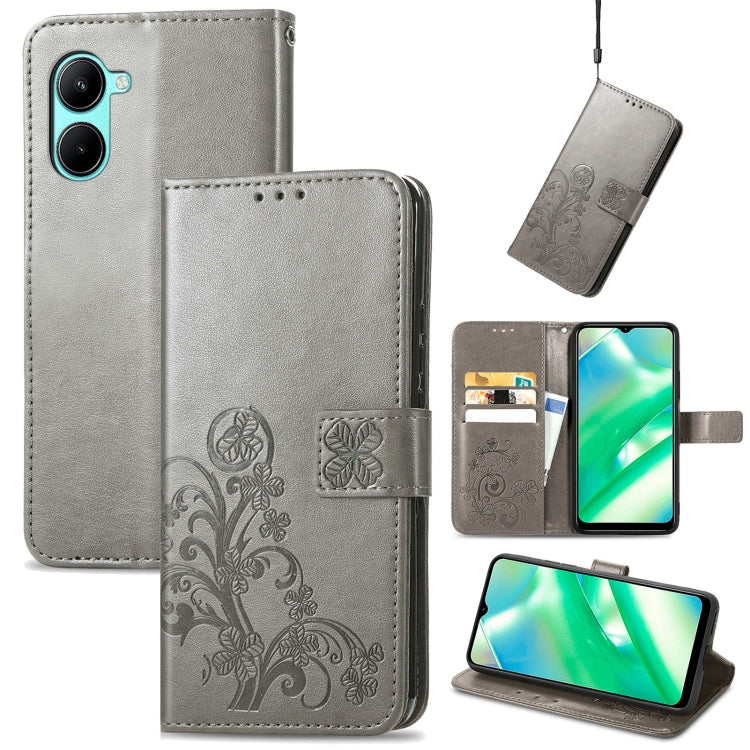 Gray embossed leather wallet phone case with four-leaf clasp, card slots, and kickstand.