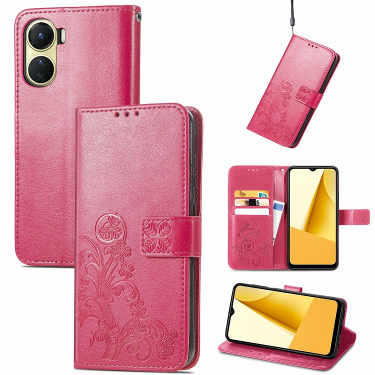 Magenta embossed leather wallet phone case with four-leaf clasp, card slots, and kickstand.