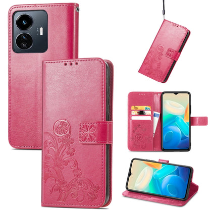 Pink embossed leather wallet phone case with four-leaf clasp and card slots