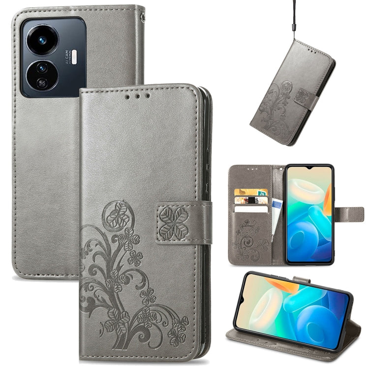 Gray folio leather phone case with embossed floral four-leaf clasp and card slots