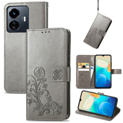 Gray folio leather phone case with embossed floral four-leaf clasp and card slots