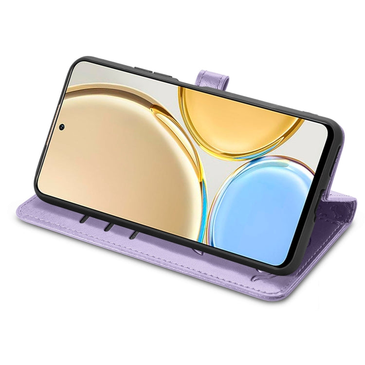 Purple embossed leather-style flip phone case with cat and dog pattern, stand view.