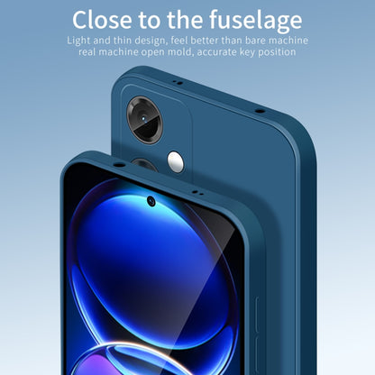 Blue silicone TPU phone case with camera cutouts and slim side buttons.