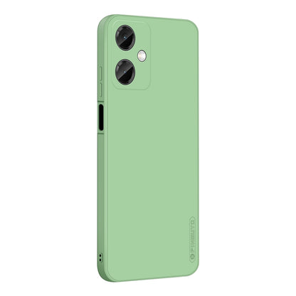 Green liquid silicone TPU phone case with dual camera cutouts and raised lip protection