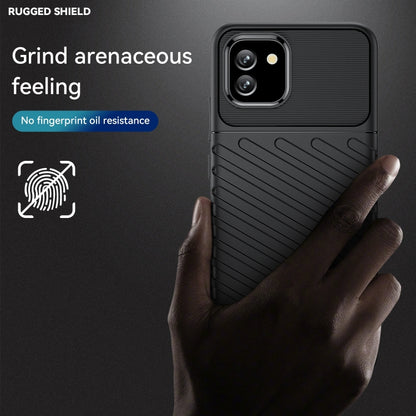 Black rugged shockproof TPU phone case with textured back, shown with a hand hold