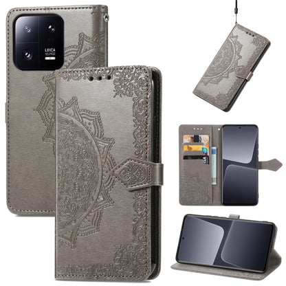 Gray embossed leather folio phone case with mandala flower pattern, card slots, and strap