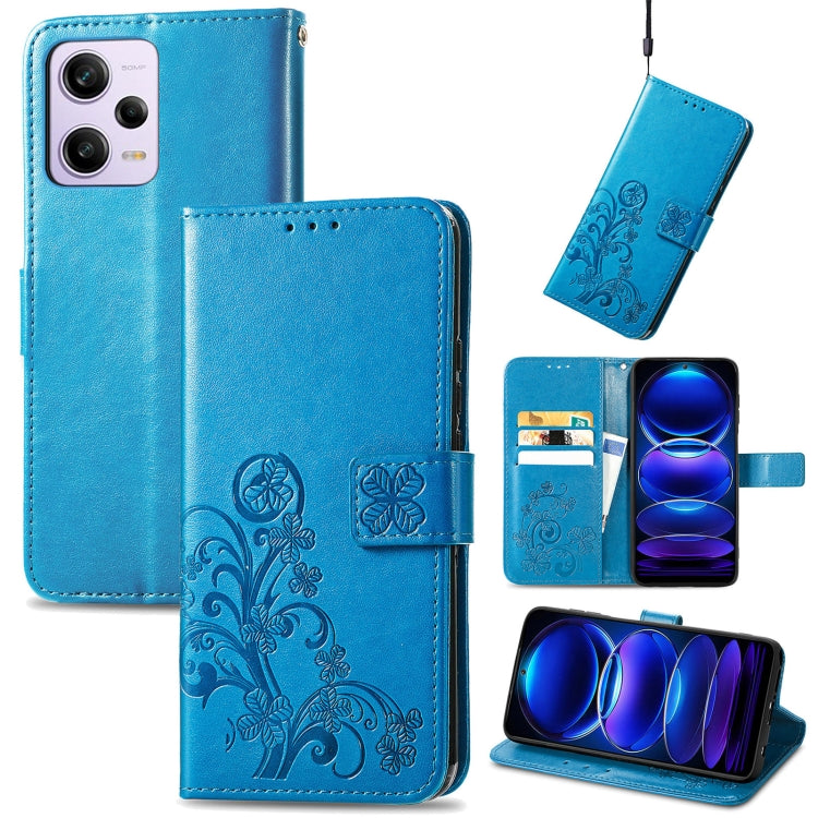 Blue leather phone case, embossed four-leaf clasp and floral pattern, flip folio wallet.