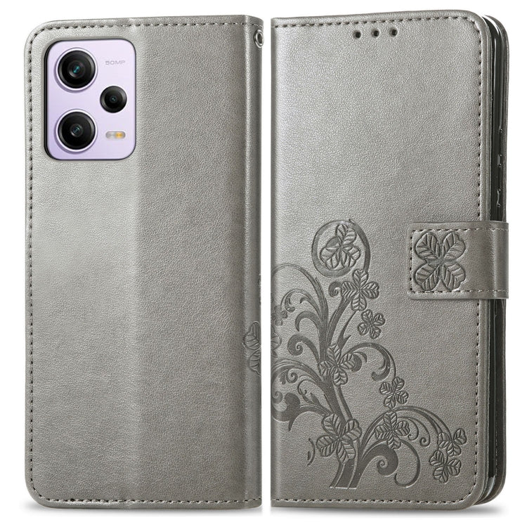 Gray leather folio phone case with embossed floral panel and side card slot