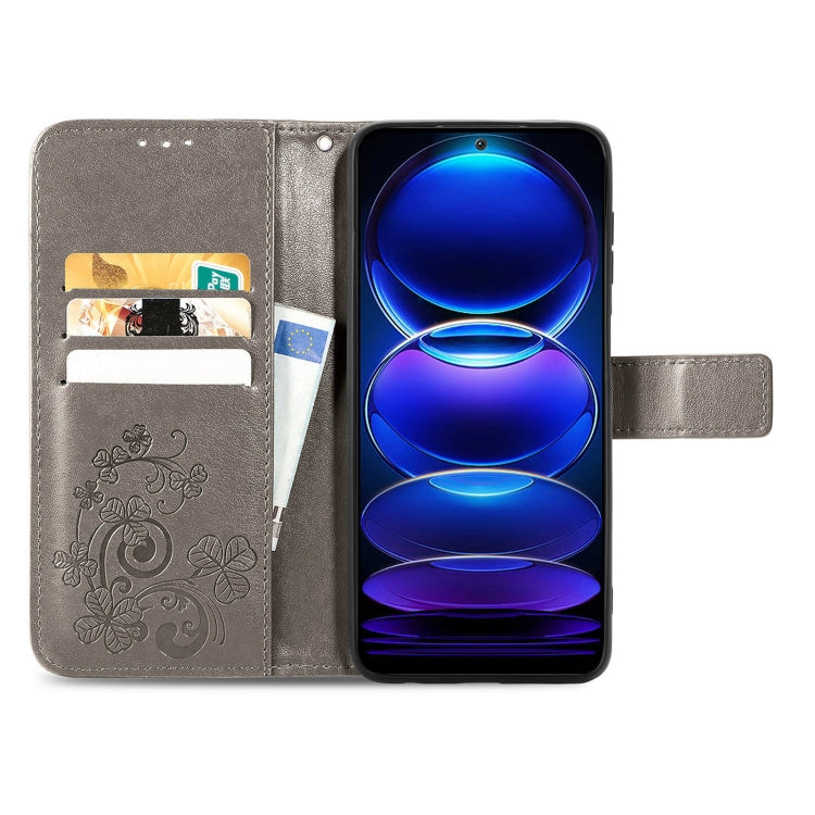 Gray leather flip phone case with embossed floral exterior and inner card slots