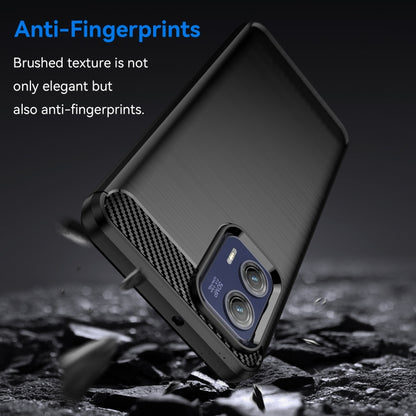 Dark brushed TPU phone case with carbon-fiber accent and camera cutout, angled view
