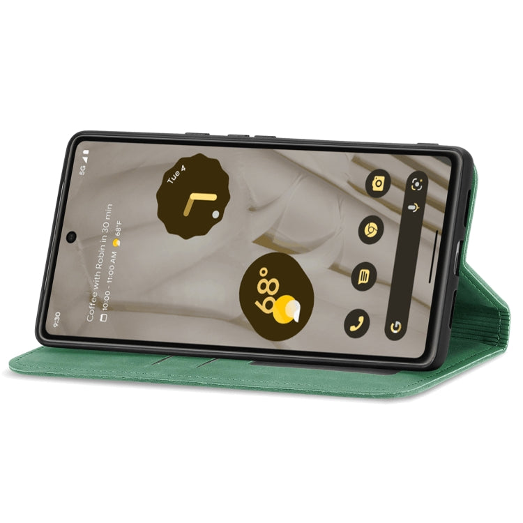 Green magnetic flip leather phone case in landscape stand position.