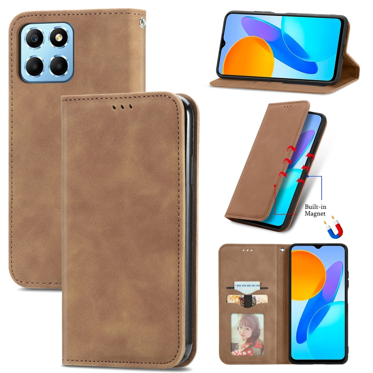 Brown magnetic flip leather phone case with camera cutout and speaker opening.